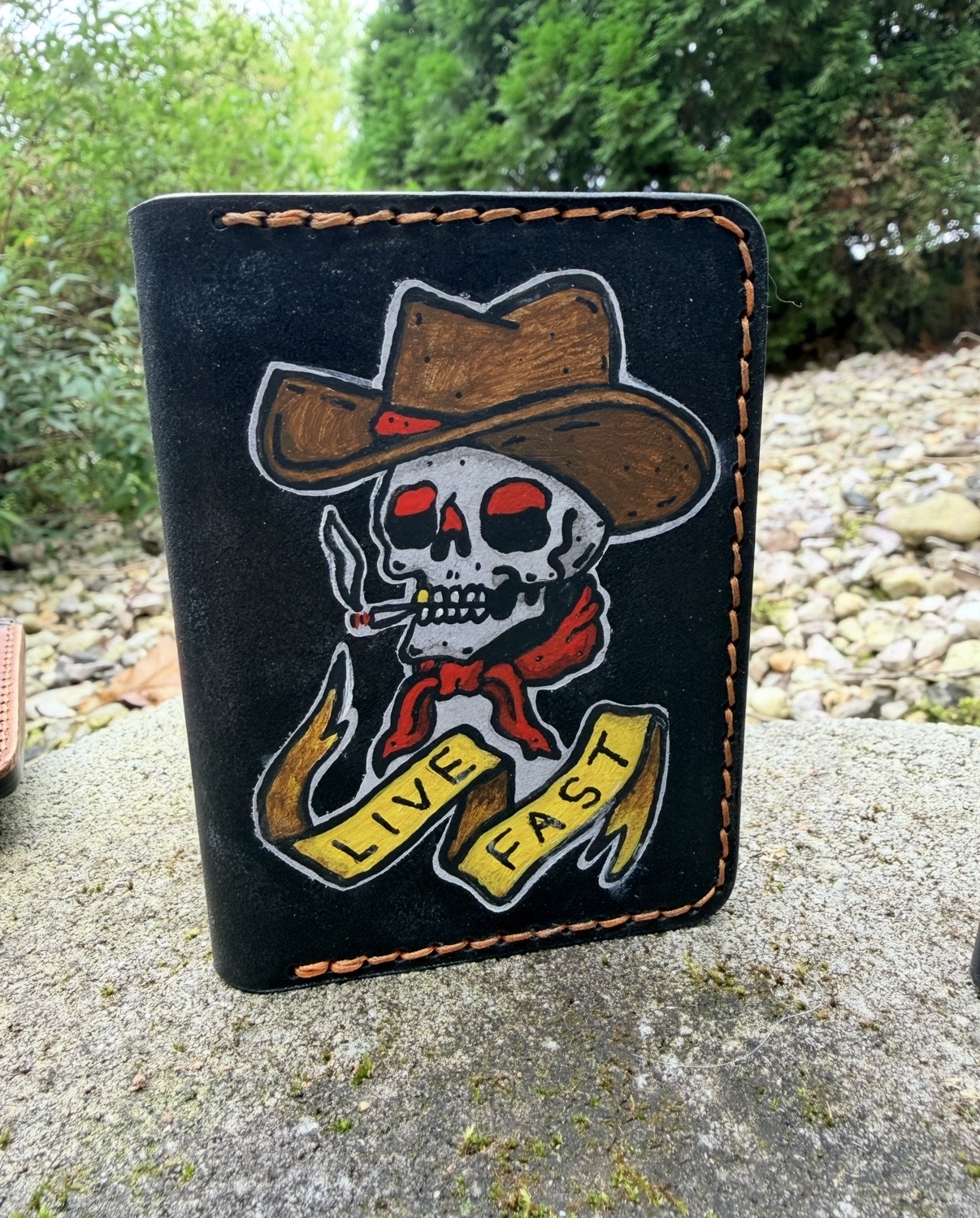 Handcrafted leather wallet with a cowboy skull and Live Fast banner